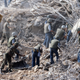 American Marines search for survivors and bodies in the rubble, all that was left of their barracks head quarters in Beirut, after a terrorist suicide car bomb was driven into the building and detonated, killing 241 US servicemen and wounding over 60.